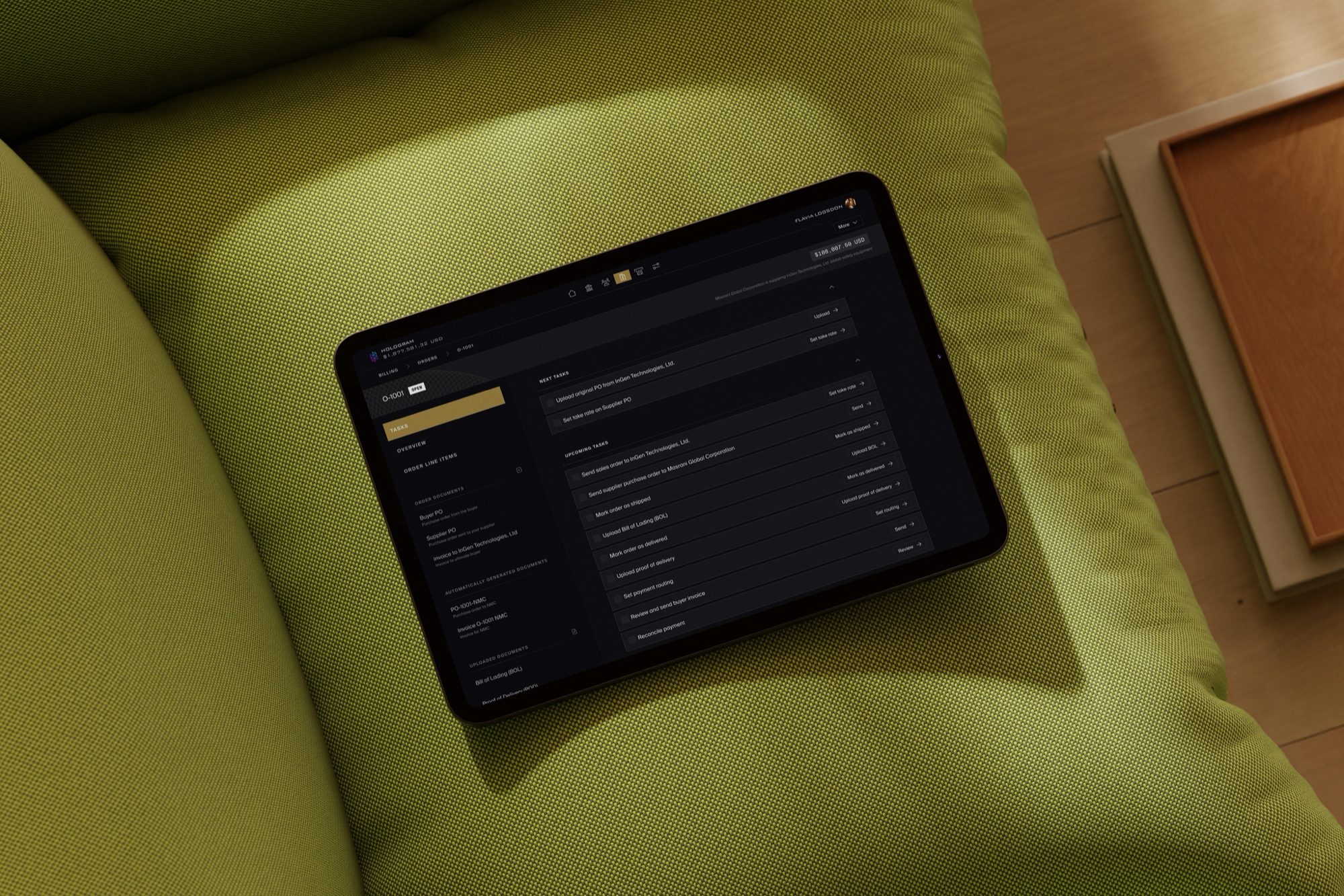 The New Money Company’s order workspace on a tablet, open on order O-1001 for $108,007.50: a checklist running from uploading the buyer’s purchase order through marking the order shipped and delivered to reconciling payment, beside a sidebar of the documents the order generates along the way